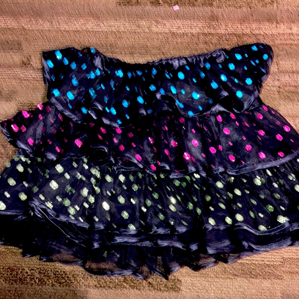 It’s a glitter skirt all black with sparkly dots